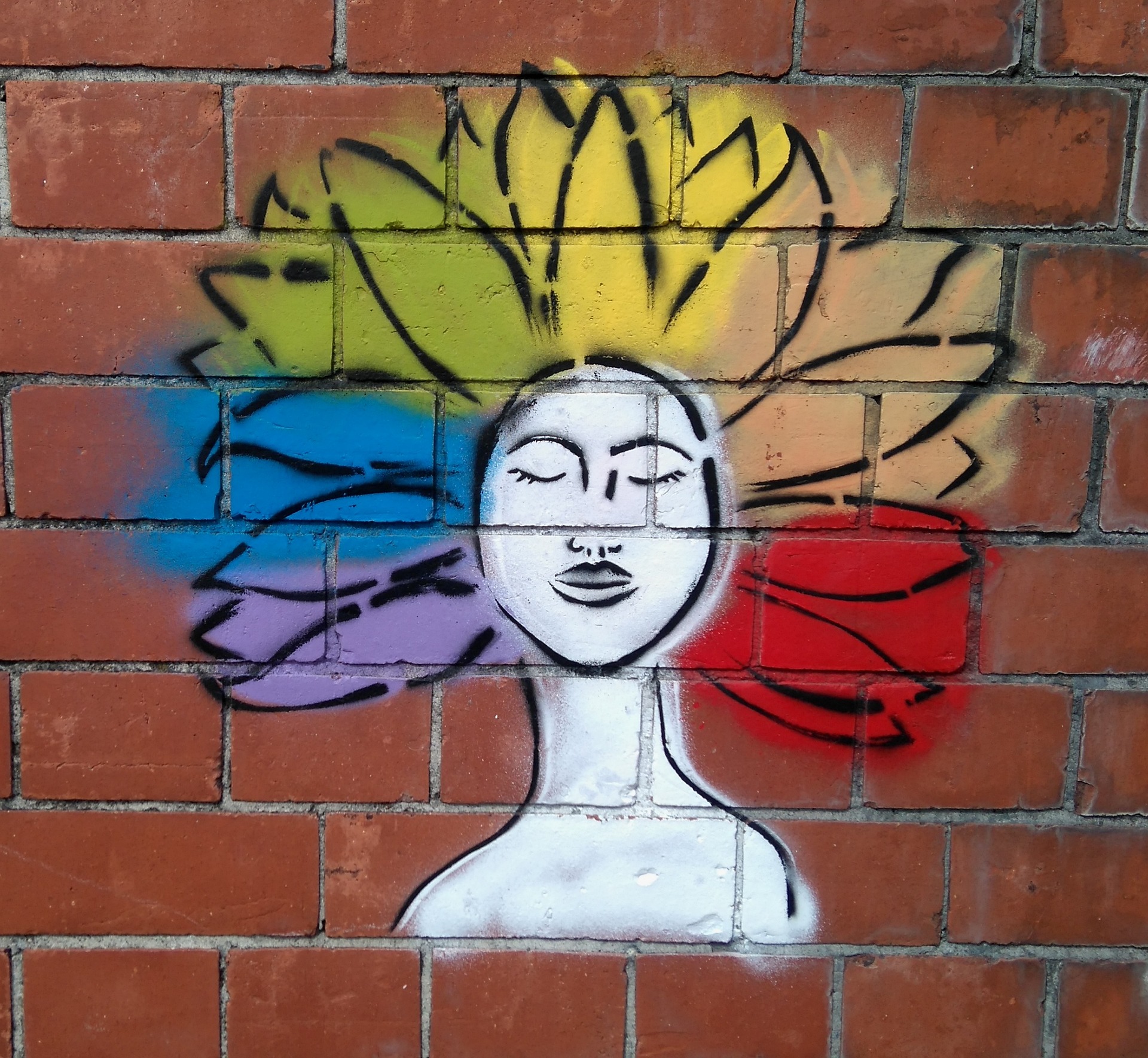 graffiti av en person med olika färger som skickas ut via håret